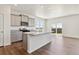 Modern kitchen with gray cabinets, granite countertops, and island at 27480 E Cedar Pl, Aurora, CO 80018