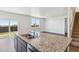 Kitchen island with granite countertop and double sink at 27480 E Cedar Pl, Aurora, CO 80018