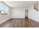 Bright living room featuring hardwood floors and large windows at 27480 E Cedar Pl, Aurora, CO 80018