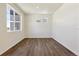 Simple office space featuring wood-look flooring and large window at 27480 E Cedar Pl, Aurora, CO 80018