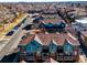 A high-angle aerial view showcases neat rows of townhomes in a well-maintained community at 7352 E 7Th Ave # 7, Denver, CO 80230