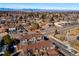 A scenic aerial view showcasing the neighborhood with city skyline and mountain views at 7352 E 7Th Ave # 7, Denver, CO 80230