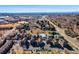 Expansive aerial view shows a community surrounded by lush greenery and a sprawling cityscape at 7352 E 7Th Ave # 7, Denver, CO 80230