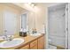 Dual sink bathroom with large mirror and bath and shower combo at 7352 E 7Th Ave # 7, Denver, CO 80230