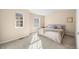 Bright bedroom features two windows, neutral walls, and plush carpet at 7352 E 7Th Ave # 7, Denver, CO 80230