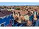 A picturesque aerial view of townhomes showcasing a charming neighborhood with mountain views in the background at 7352 E 7Th Ave # 7, Denver, CO 80230