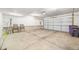 Spacious garage with a clean concrete floor, a large garage door, and ample space at 7352 E 7Th Ave # 7, Denver, CO 80230