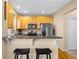 A well-equipped kitchen featuring a breakfast bar and stainless steel appliances at 7352 E 7Th Ave # 7, Denver, CO 80230