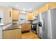 Bright kitchen showcases wooden cabinets, stainless steel appliances, and countertop space at 7352 E 7Th Ave # 7, Denver, CO 80230