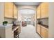 Open-concept living area with built-in cabinets leading to a bright living room with plush seating at 7352 E 7Th Ave # 7, Denver, CO 80230