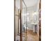 Cozy bathroom featuring tiled shower with glass door and pedestal sink at 3419 Stuart St, Denver, CO 80212