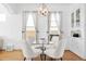 Dining area featuring a glass-top table and a custom-built display cabinet at 3419 Stuart St, Denver, CO 80212