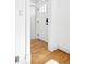 Bright foyer features gleaming hardwood floors and fresh white trim at 3419 Stuart St, Denver, CO 80212