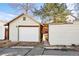 Detached garage with brick pathway and white clapboard siding at 3419 Stuart St, Denver, CO 80212