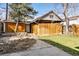 Detached garage in backyard of property with stone pathway and grassy yard at 3419 Stuart St, Denver, CO 80212