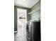 Modern laundry room featuring stacked washer/dryer and slate tile floors at 3419 Stuart St, Denver, CO 80212