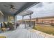 Relaxing back deck with comfortable seating, a ceiling fan, and a pergola, perfect for enjoying the outdoor scenery at 12650 W Big Horn Cir, Broomfield, CO 80021