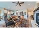 Spacious living room featuring hardwood floors, stone fireplace, and open concept design at 12650 W Big Horn Cir, Broomfield, CO 80021