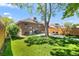Scenic backyard with a green lawn, brick home exterior, and outdoor seating area at 3332 N Vine St, Denver, CO 80205