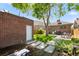Beautiful backyard with a brick garage, and a green lawn at 3332 N Vine St, Denver, CO 80205