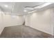Finished basement with carpeted floors and access to storage and stairs at 3332 N Vine St, Denver, CO 80205