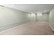 Spacious unfinished basement with carpet flooring and natural light from a single window at 3332 N Vine St, Denver, CO 80205
