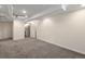 Spacious finished basement with carpet and access to bathroom and storage room at 3332 N Vine St, Denver, CO 80205