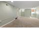 View of a versatile unfinished basement area, with carpet flooring and a small window at 3332 N Vine St, Denver, CO 80205