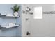 Updated bathroom with a white tiled shower and shelves for storage at 3332 N Vine St, Denver, CO 80205