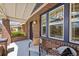 Cozy front porch with chairs, detailed brickwork, and ample natural light creating a welcoming space at 3332 N Vine St, Denver, CO 80205