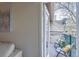 Private balcony with chairs overlooking foliage and a glimpse of building exterior at 9510 E Florida Ave # 3055, Denver, CO 80247