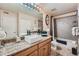 Stylish bathroom features a granite countertop, vessel sink, and tiled shower and tub at 9510 E Florida Ave # 3055, Denver, CO 80247