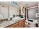 Bathroom featuring granite countertops, a vessel sink, and a tiled shower-tub combination at 9510 E Florida Ave # 3055, Denver, CO 80247
