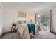 Comfortable bedroom with sliding glass doors to a private balcony and natural light at 9510 E Florida Ave # 3055, Denver, CO 80247
