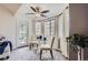 Cozy dining area with lots of natural light, a ceiling fan, and access to patio at 9510 E Florida Ave # 3055, Denver, CO 80247