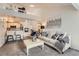 Bright living room with high ceilings, an open floorplan, and a loft space above at 9510 E Florida Ave # 3055, Denver, CO 80247