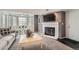 Inviting living room featuring a fireplace and cozy seating area with large bright windows at 9510 E Florida Ave # 3055, Denver, CO 80247