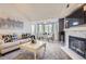 Bright living room with fireplace, dining area, and large windows offers a relaxing space at 9510 E Florida Ave # 3055, Denver, CO 80247