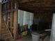 Unfinished basement with wooden stairs at 1805 Hidden Valley Rd, Sedalia, CO 80135