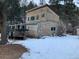 Exterior of home with trailer and snow-covered yard at 1805 Hidden Valley Rd, Sedalia, CO 80135