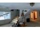 Bright living room featuring stairs, a large window, and light fixtures at 1805 Hidden Valley Rd, Sedalia, CO 80135