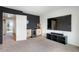 Carpeted media room with large TV, snack bar, and beverage cooler for ultimate relaxation at 47312 Lilac Ave, Bennett, CO 80102
