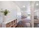 Bright entryway with dark wood floors, white walls, and view to the living room at 47312 Lilac Ave, Bennett, CO 80102