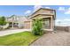 Charming two-story home with a well-maintained lawn and an attached garage at 47312 Lilac Ave, Bennett, CO 80102
