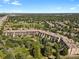 An aerial view of the sprawling community with beautiful landscaping and surrounding green space at 7000 E Quincy Ave # 302, Denver, CO 80237