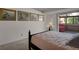 This cozy bedroom is illuminated with natural light and features art-filled walls at 7000 E Quincy Ave # 302, Denver, CO 80237