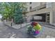 Inviting building entrance with manicured landscaping and accessible ramp for easy access at 7000 E Quincy Ave # 302, Denver, CO 80237