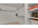 Walk-in closet with built in shelving and carpeted floor at 7000 E Quincy Ave # 302, Denver, CO 80237