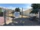 Fenced community dog park for tenants' use with a bench and shade trees at 7000 E Quincy Ave # 302, Denver, CO 80237