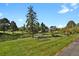 Well-manicured landscaping and benches to enjoy the pond and community at 7000 E Quincy Ave # 302, Denver, CO 80237